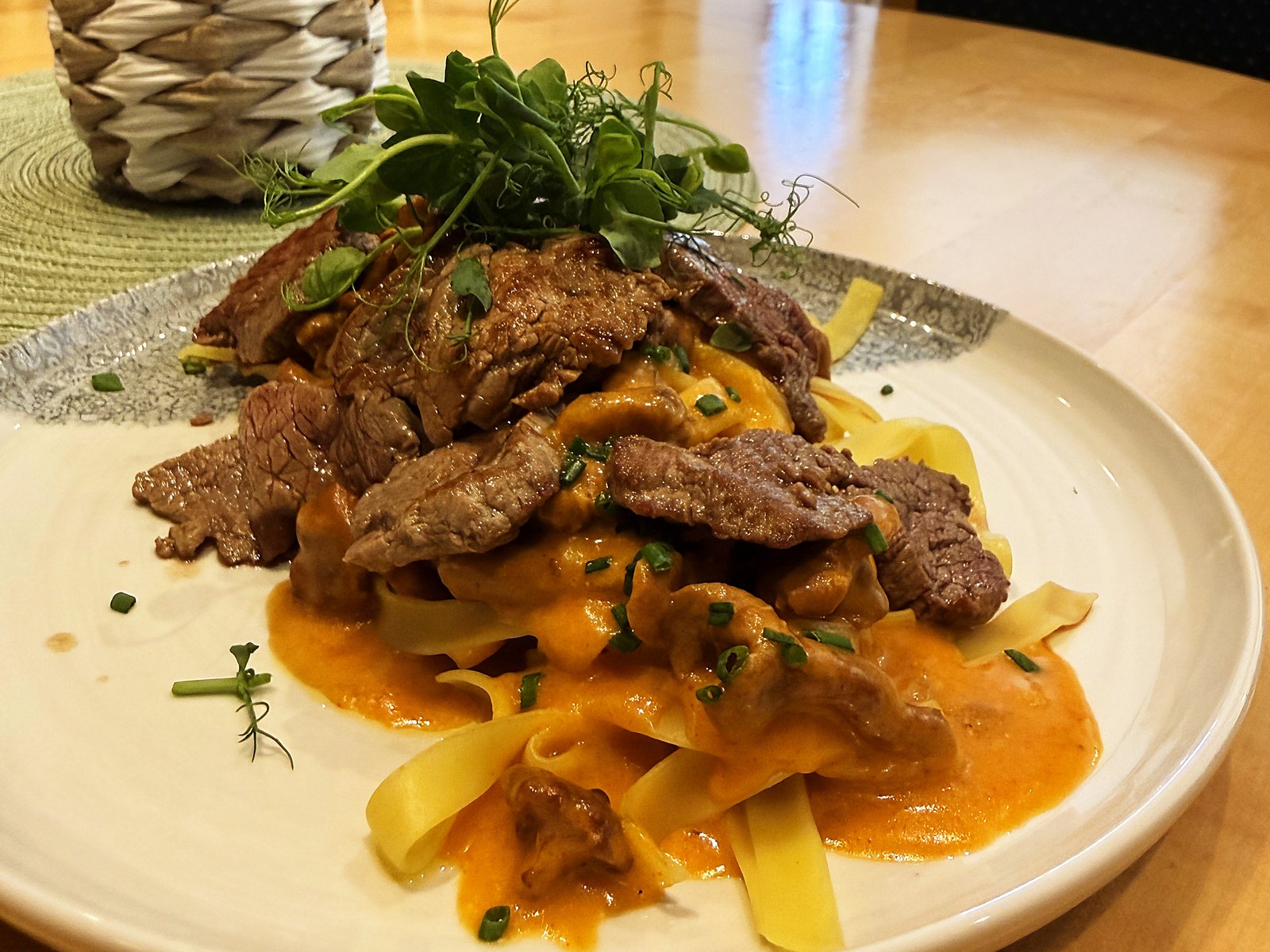 Ribbon pasta with strips of beef in paprika cream, plated at the Georgenwirt
